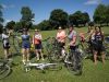 Group of friends stop at Aylmer Marina during their Escape day bike tour from Ottawa to Aylmer to relax at the beach