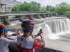 Guests are looking at Rideau falls during their bike and spa tour in Ottawa with Escape tours and rentals on Sparks