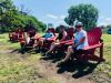 Friends sitting on adirondack chairs looking at Ottawa River during bike & spa tour in ottawa with Escape tours and rentals 