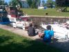 Kids sitting and watching boats crossing Rideau Canal locks during bike & boat bike tours of Ottawa with escape on Sparks