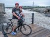 A couple are enjoying the view of Chaudiere Falls during Ottawa multi-day bike tour by Escape tours rentals on Sparks