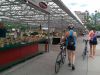 Guest are biking through Ottawa farmers’ market during best of Ottawa Neighbourhood and nature bike tour with Escape