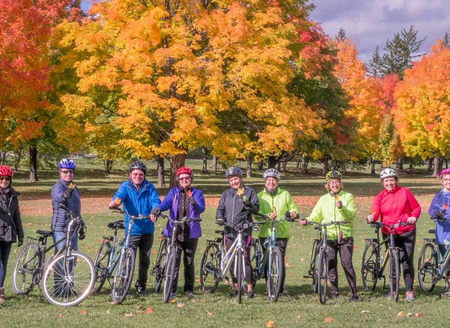 Tour guests watching Fall tree colours in Jacque cartier park during best of Ottawa day tour by bike by Escape on Sparks