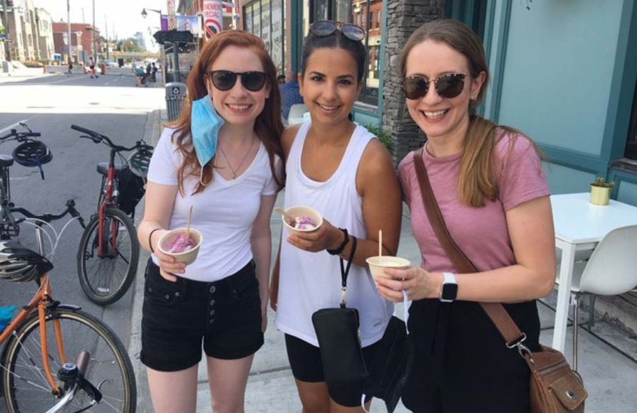 A group of girl friends are eating artisan Moo Shu ice cream during one of Escape specialty tours called Bike and Food tour in Ottawa