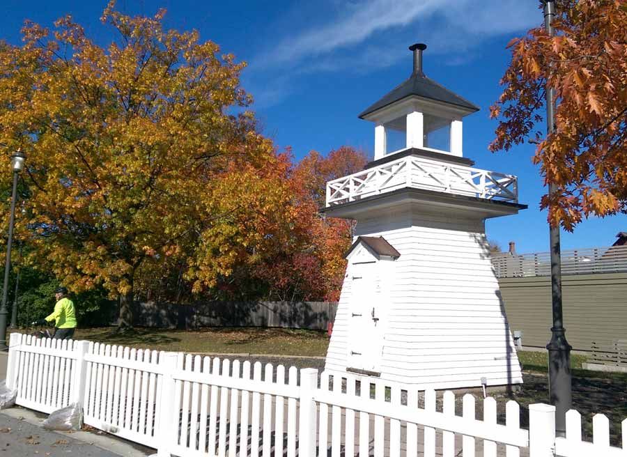 View of a lighthouse at historic Upper Canada Village during Cornwall multi-day cycling tour by Escape bicycle tours rentals