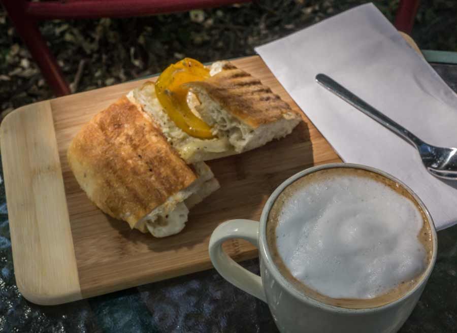 Lunch stop at a local cafe with panini sandwich and Cappuccino during best of Ottawa day tour by bike by Escape on Sparks