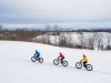 Friends riding in snow in Ottawa with fat bikes with Escape fat bike rentals