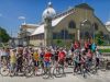 A group of students taking an Ottawa bike tour with Escape and stop at Lansdowne park landmark for rest and sightseeing