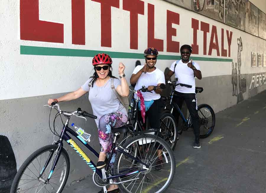 Small group visiting Little Italy neighbourhood during Escape best of Ottawa neighbourhood and nature bike tour 