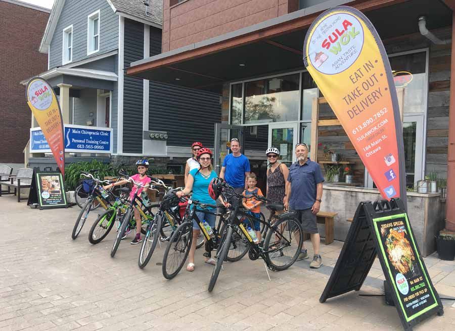 Guest sample delicious tacos at Old Ottawa East local eatery during bike and food tour of Ottawa with Escape Tours rentals