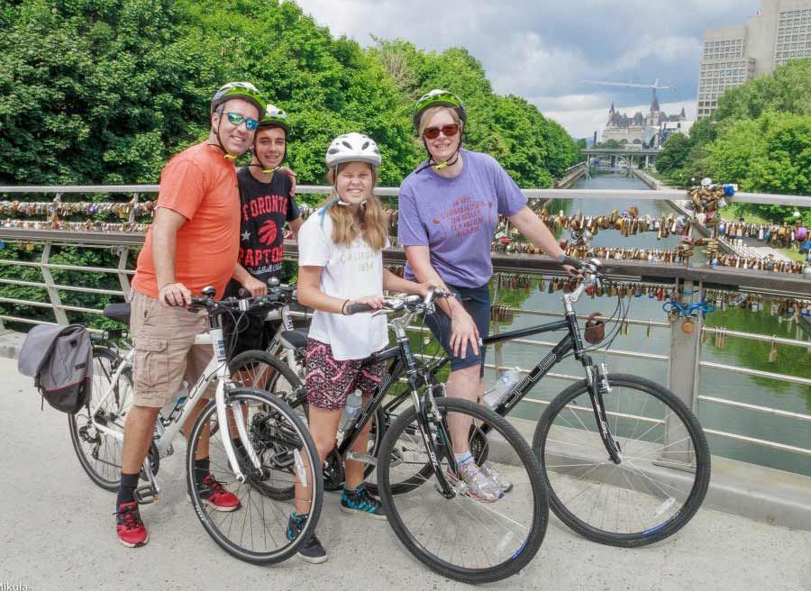 Family visits Corktown bridge when biking on Rideau Canal during Ottawa express tour by Escape Tours Rentals