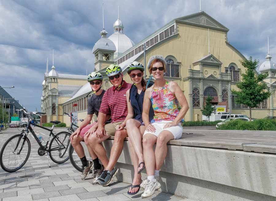 Tour participants visit Lansdowne park and horticultural building during their private bike tours of Ottawa with Escape