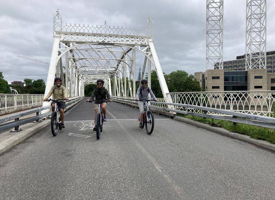 A group is enjoying biking in Ottawa's neighbourhood during Ottawa Electric Bike Tour with Escape.