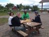 Guests are enjoying a picnic lunch at Petrie island during during Ottawa day tour by bike with Escape tours rentals