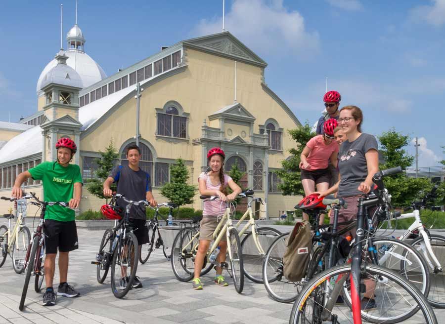 Young guests stop to rest and learn at Lansdowne park landmark, Aberdeen pavilion to during best of Ottawa bike tour with Escapes