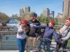 Tour guests are pointing out to a landmark at Love Lock Corktown Bridge at Rideau Canal during Ottawa highlights bike tour