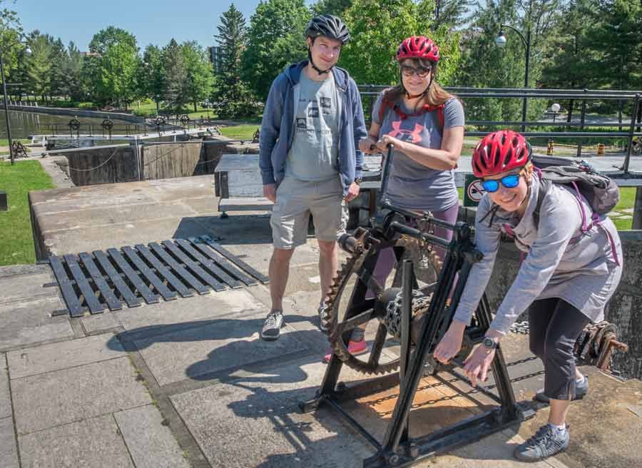 Small group enjoying Escape Ottawa highlights bike tour at Rideau Canal locks