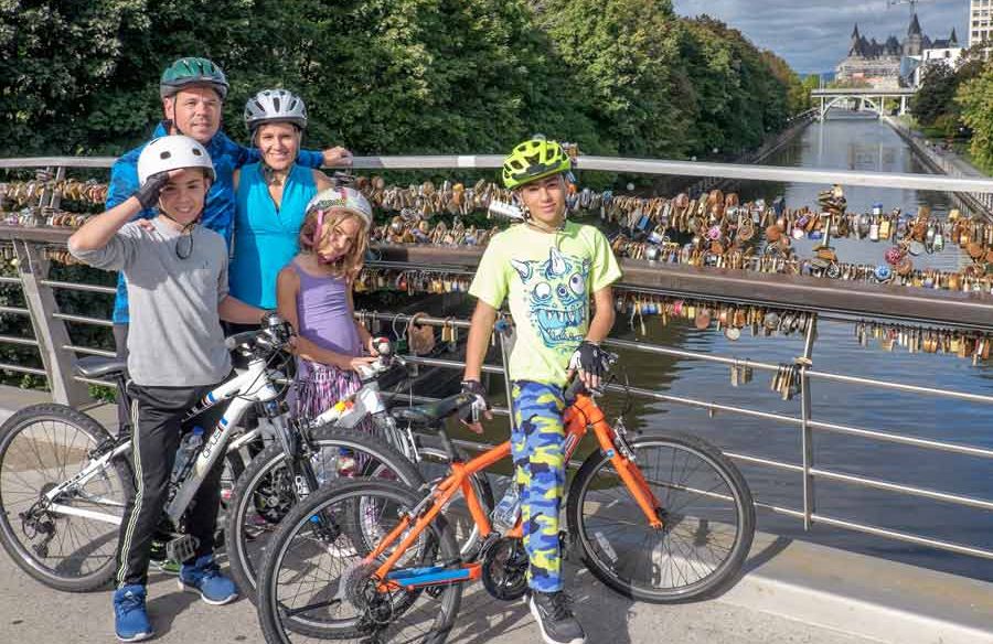 A family with kids ages 7 to 11 years old rented kids’ bikes from Escape tours and rentals and biking on Rideau Canal, Ottawa