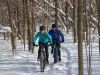 Couples are fat biking in bike trails in Winter in Ottawa