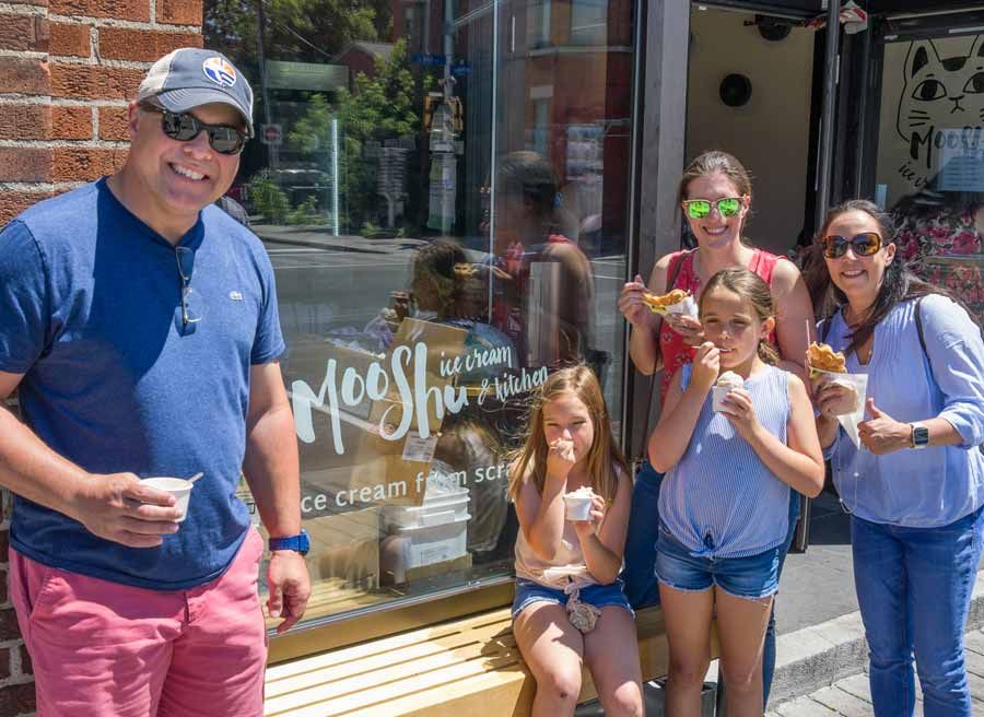Parents and kids eating artisan Moo Shu ice cream during one of Escape specialty tours called Bike and Food tour in Ottawa