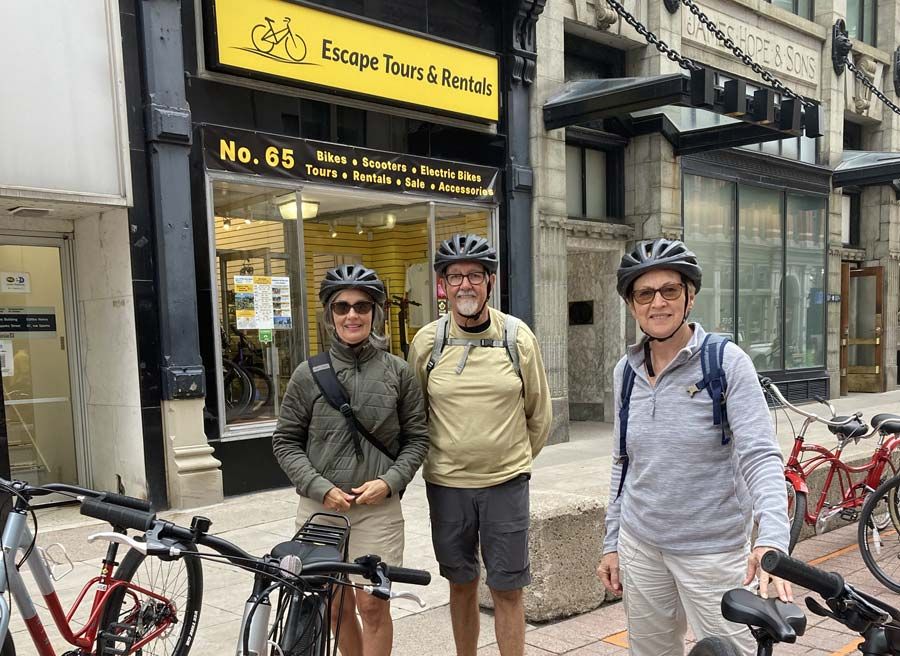A group is starting their Ottawa Electric Bike Tour in front of Escape store at 65 Sparks St.
