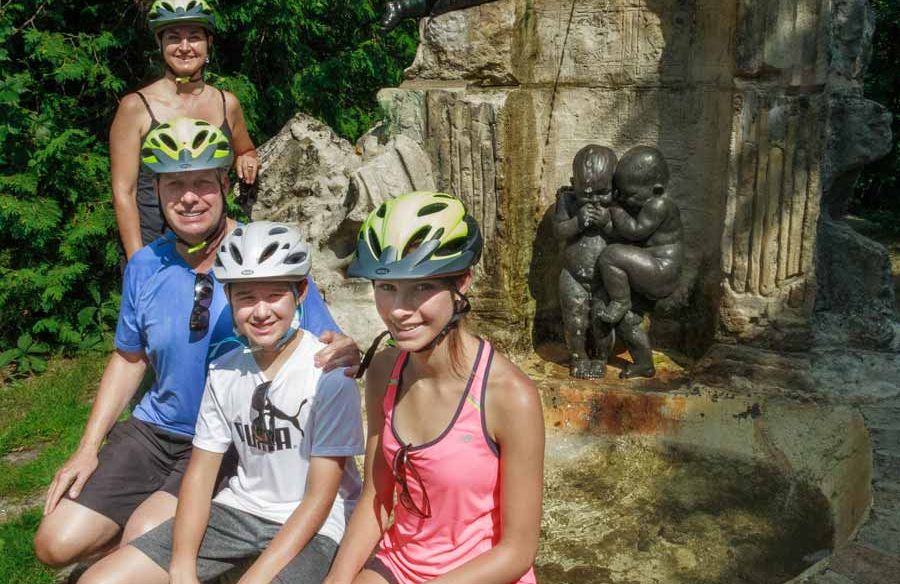 A family has stopped at one of Ottawa’s hidden gems and parks to take a picture during a private custom bike tour with Escape tours and rentals