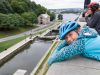 A kid is watching Rideau Canal locks from Fairmont Chateau Laurier look out during Ottawa express bike tour by Escape