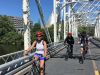 Tour participants are cycling on Minto bridge in new Edinburgh neighbourhood during Escape Ottawa express bike tour