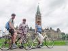 A family visits Parliament Hill and Peace Tower landmarks during best Ottawa bike tour in one day by Escape on Sparks
