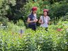 2 friends are walking through an Ottawa gardens and looking at plants during Escape garden promenade bike tour in Ottawa