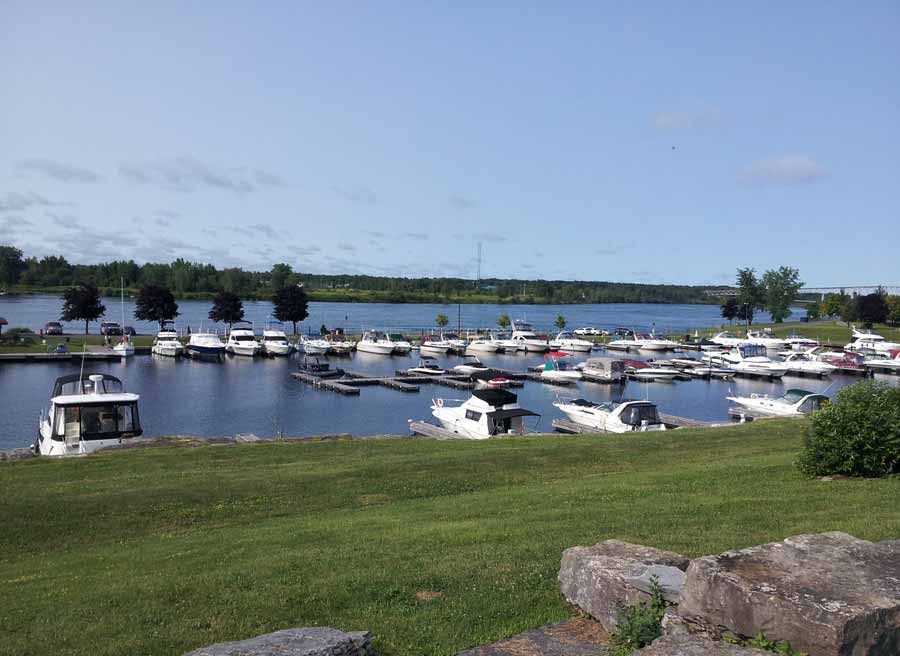 View of St. Lawrence River Marina & boats at Upper Canada Village during Cornwall multi-day bike tour by Escape tours rentals
