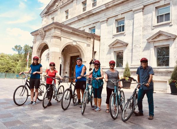 Escape Bicycle Tour Group in front of Rideau Hall Building in Ottawa