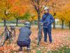 Guests looking at Fall colours and taking pictures in Ottawa park during Escape best of Ottawa Neighbourhood and nature tour 