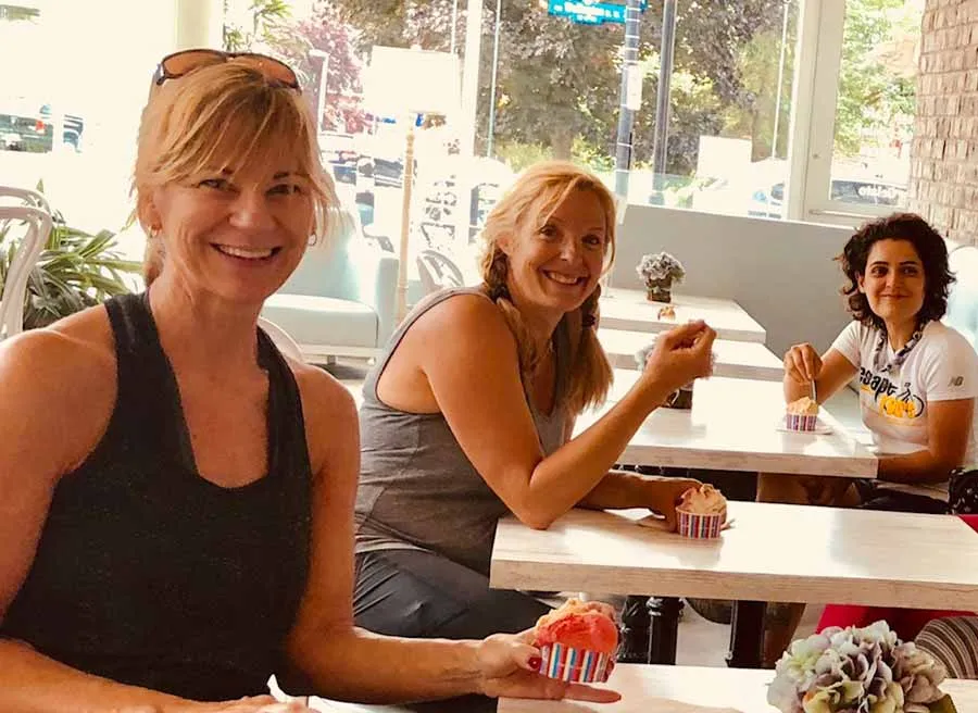 Participants eating artisan Stella Luna ice cream in Hintonburg neighbourhood during private bike and food tour in Ottawa