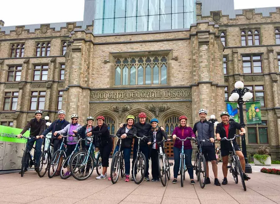 Participants of a corporate group bike and food tour stop at Museum of nature to learn and take picture with Escape