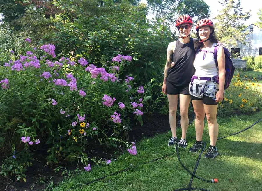 Participants taking a picture a Fletcher WildLife Garden during Escape garden promenade self-guided bike tour in Ottawa