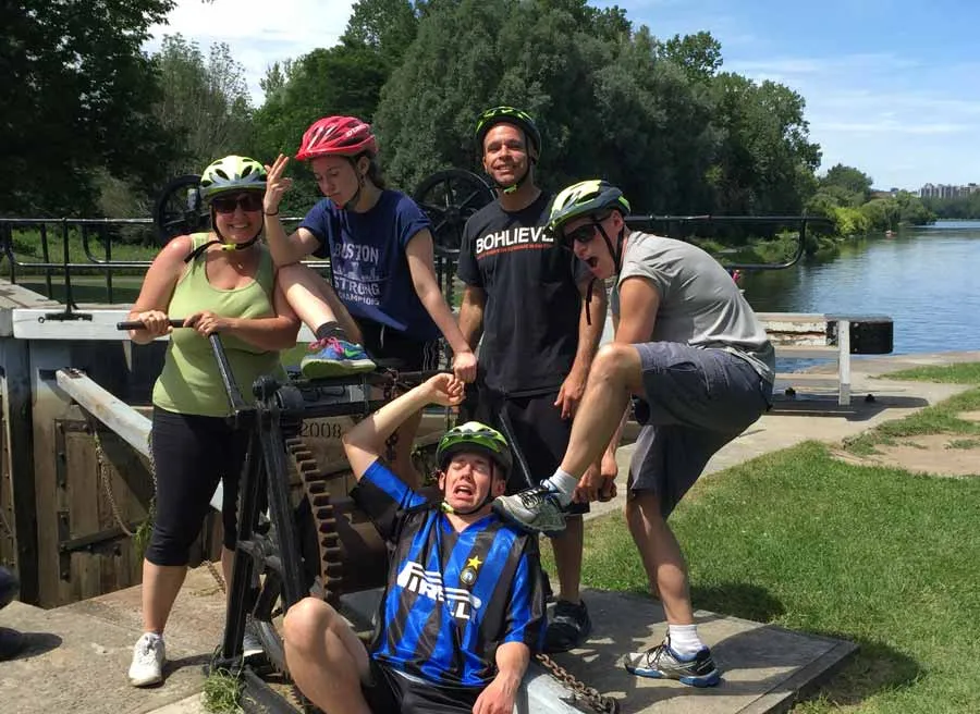 Tour guests are having fun at Rideau Canal locks during during best of Ottawa Neighbourhood and nature bike tour with Escape