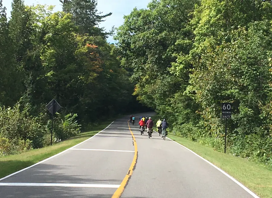 Beautiful trees & Fall colours landscape when biking on Long Sault Islands during Cornwall day bike tour by Escape tours