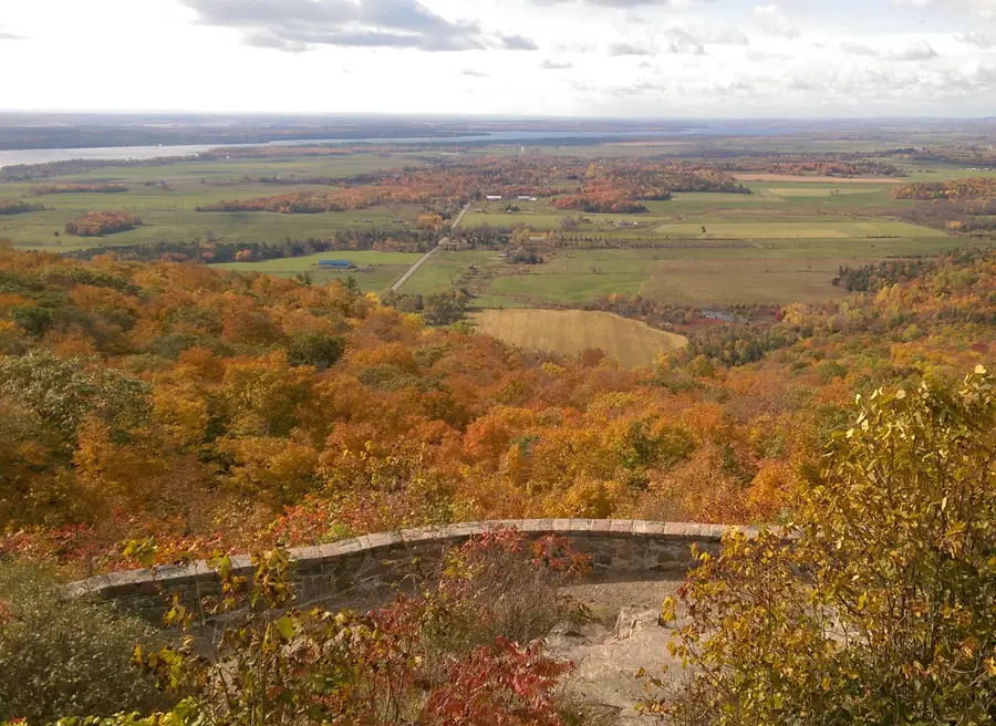 View of fall colours & St. Lawrence River at Upper Canada Village during day bike tour to Cornwall by Escape tours rentals