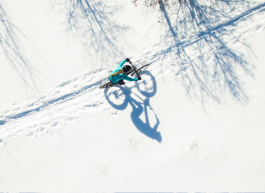 A woman is riding a fat bike in winter in Ottawa