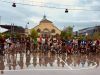 Students taking an Ottawa bike tour with Escape and stop at Lansdowne park landmark and Glebe neighbourhood for sightseeing