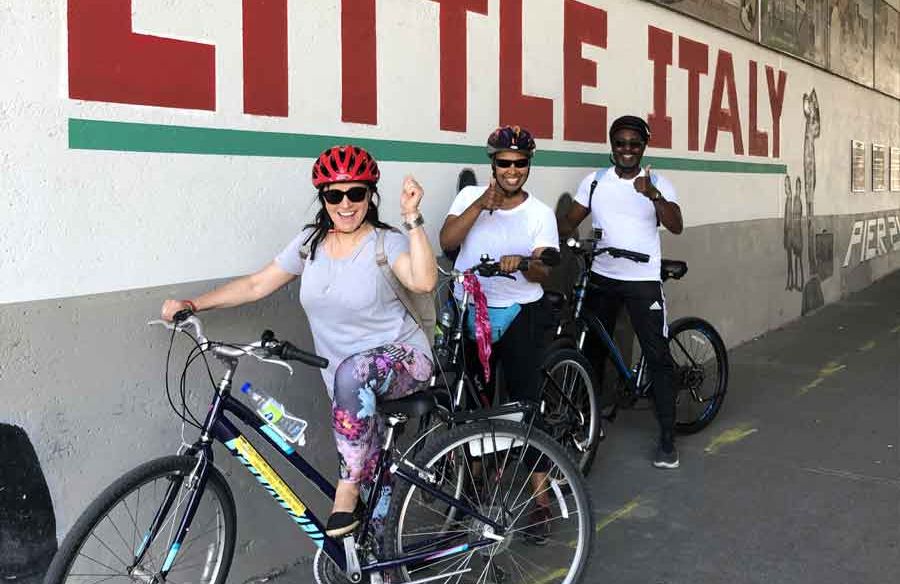 Small group visiting Little Italy neighbourhood during Escape best of Ottawa neighbourhood and nature bike tour 