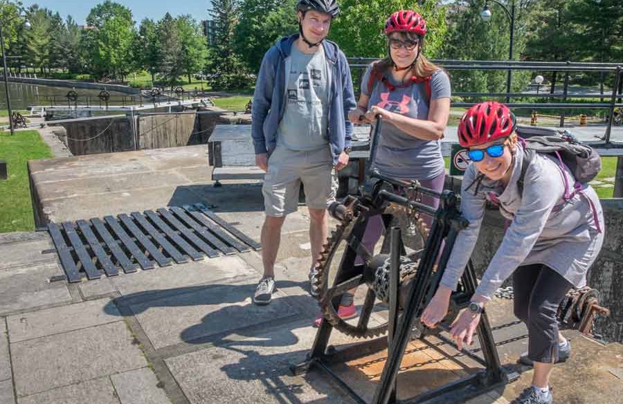 Small group visiting Little Italy neighbourhood during Escape best of Ottawa neighbourhood and nature bike tour 