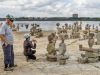 Participants visit Remic Rapids and take picture of rock sculptures during Ottawa multi-day cycling tour by Escape on Sparks