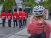 A guest is watching and taking a picture of the change of guard ceremony at Rideau Hall during best of Ottawa bike tour 