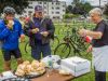 Corporate group is having picnic and eating locally made sandwiches at Little Italy during Escape private bike and food tour 