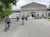 A family has joined Ottawa Electric Bike Tour with Escape in Ottawa and are biking at Rideau Hall in Ottawa