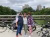 A group is enjoying a stop at Corktown Bridge on Rideau Canal during their Ottawa Electric Bike Tour with Escape.