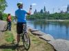 Guests stop at bike path to take pictures of Ottawa River and Parliament Building during a private Ottawa bike tour with Escape Tours Rentals
