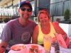 Couple celebrating anniversary with a private bike and food tour and stop for lunch and craft bear with Escape Tours Rentals